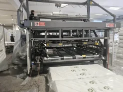 IMBUSTATRICE AUTOMATICA PER MATERASSI