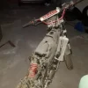 5#3899 Kia Rio e motociclette Yamaha
